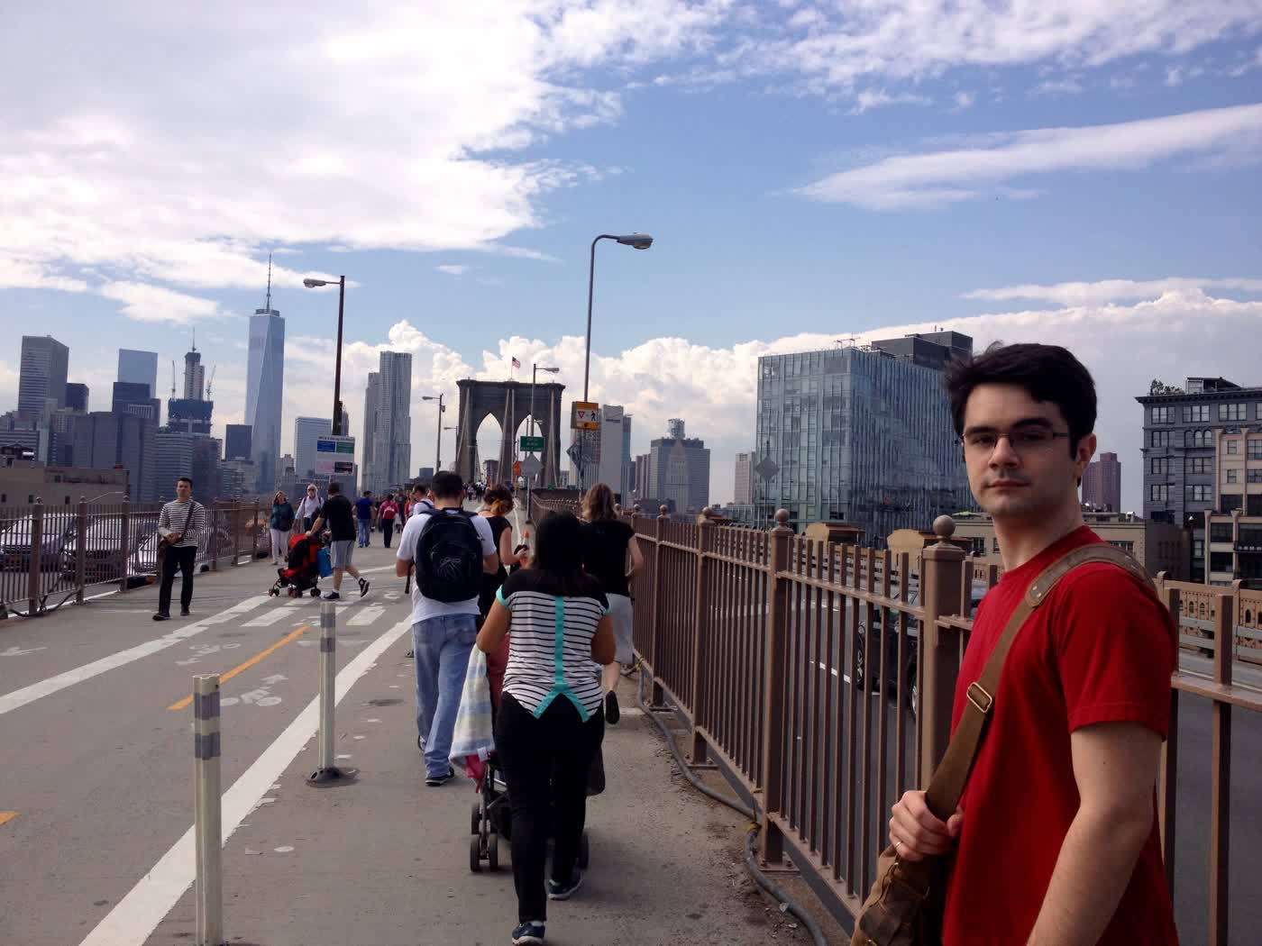 Me on the Brooklyn Bridge, the Manhattan skyline in the background.