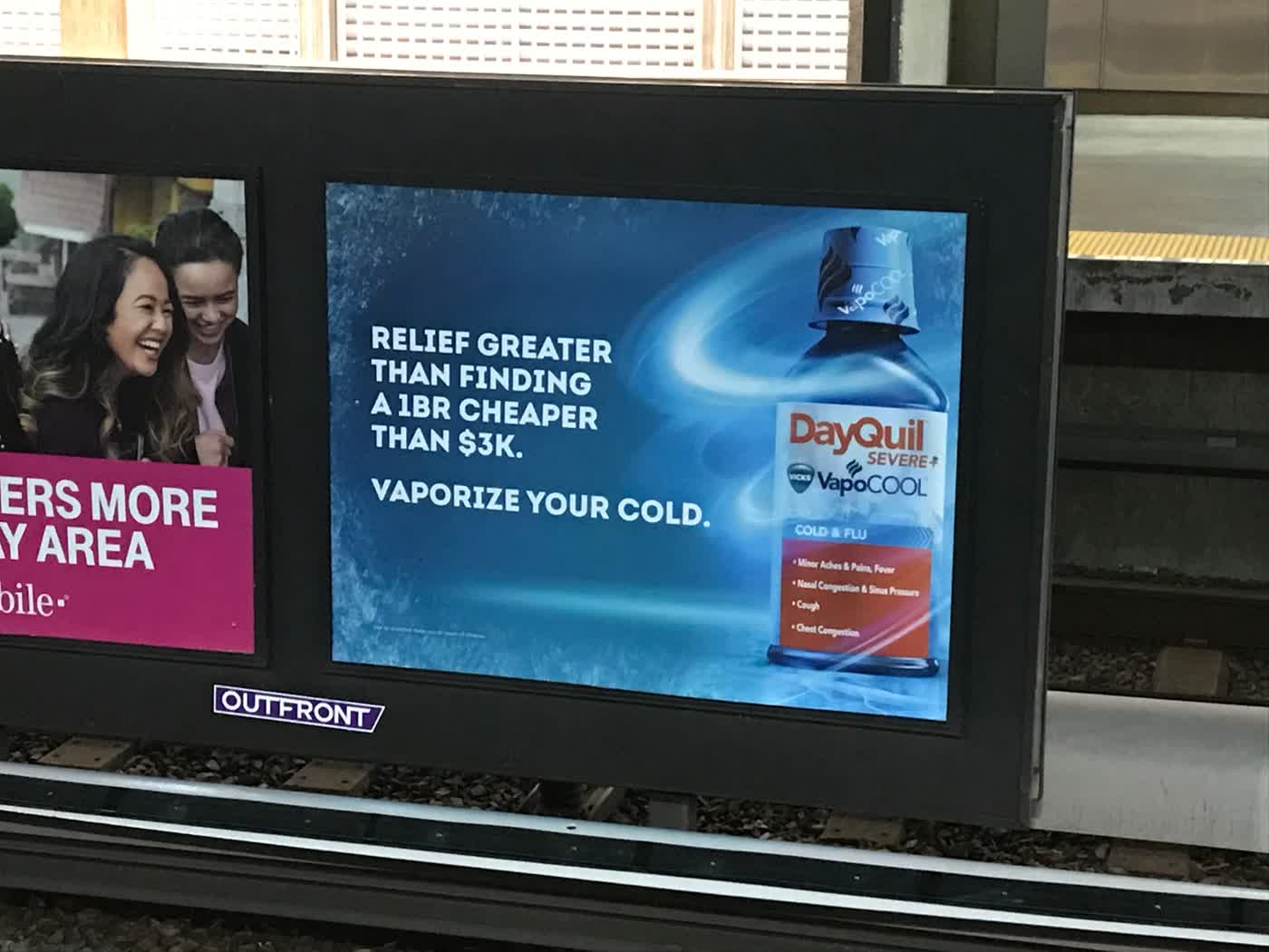 An ad for DayQuil that reads “Relief greater than finding a 1BR cheaper than $3k. Vaporize your cold.”