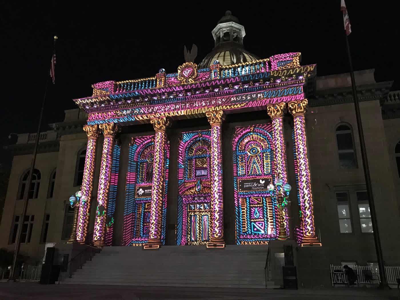 A light show projected on Redwood City's old courthouse.