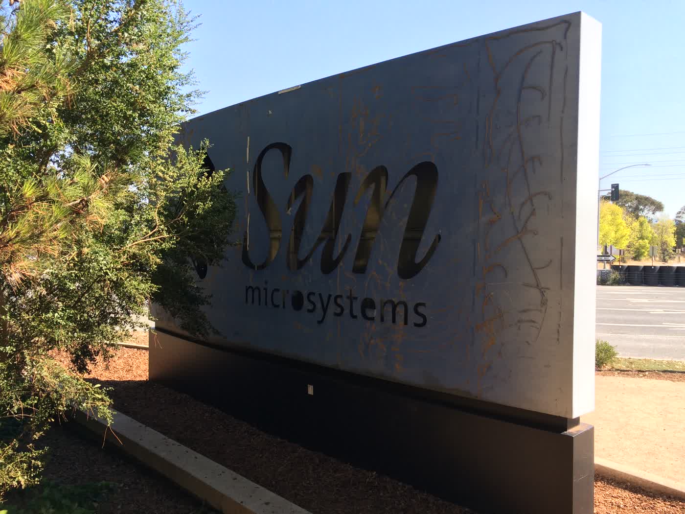 A worn-out metal sign that says “Sun microsystems”.